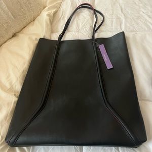 Dark navy tote with tags. Great everyday, travel or beach bag!